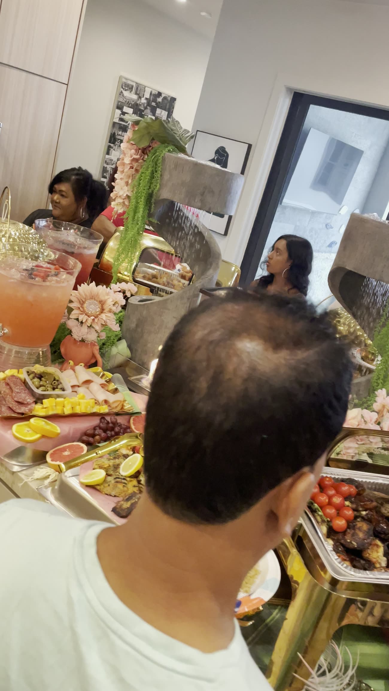 Guests gathered around a lavish event buffet